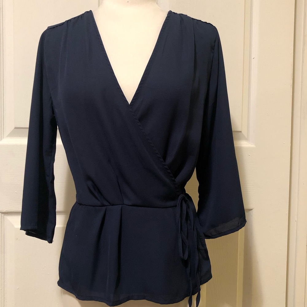 Plunge neck self tie peplum top